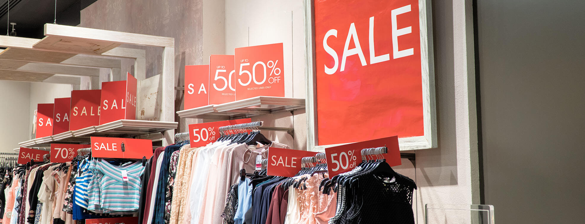 Red 50% sale signs at a Shop